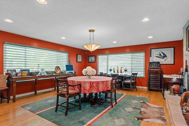 3141 Meadow Oak Dr, Cottonwood, CA 96022 - dining room featuring a textured ceiling, wood finished floors, recessed lighting, and baseboards