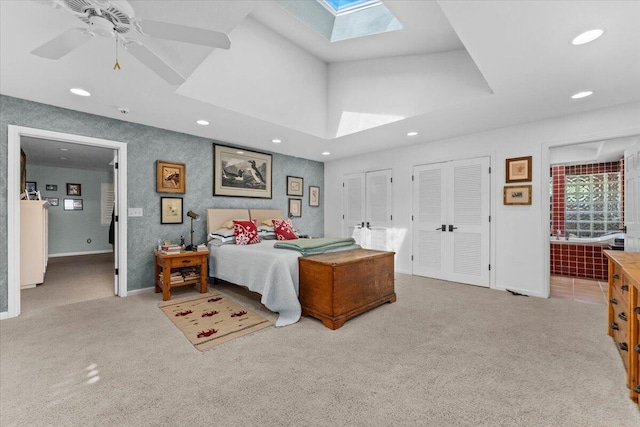 3141 Meadow Oak Dr, Cottonwood, CA 96022 - bedroom featuring a skylight, carpet floors, recessed lighting, multiple closets, and baseboards