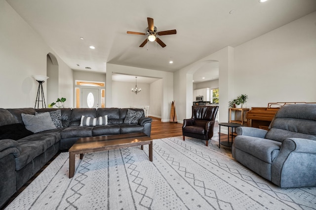 1005 Albion Ave, Redding, CA 96003 - living room with arched walkways, light wood finished floors, a ceiling fan, recessed lighting, and baseboards