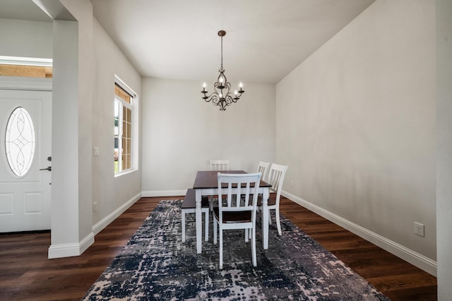 1005 Albion Ave, Redding, CA 96003 - dining space with wood finished floors, a chandelier, and baseboards