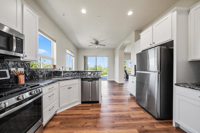 1005 Albion Ave, Redding, CA 96003 - kitchen featuring appliances with stainless steel finishes, a sink, recessed lighting, a peninsula, and white cabinets
