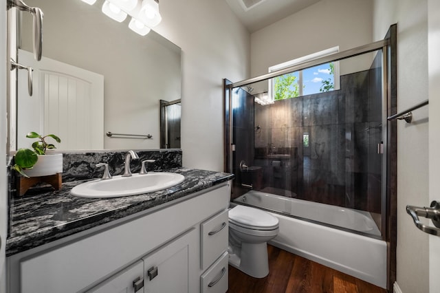 1005 Albion Ave, Redding, CA 96003 - full bath featuring vanity, toilet, wood finished floors, and combined bath / shower with glass door