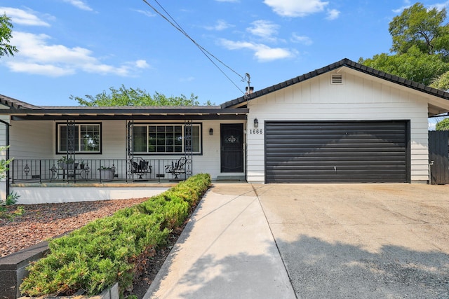 1666 Willis St, Redding, CA 96001 - ranch-style house featuring covered porch, an attached garage, and concrete driveway