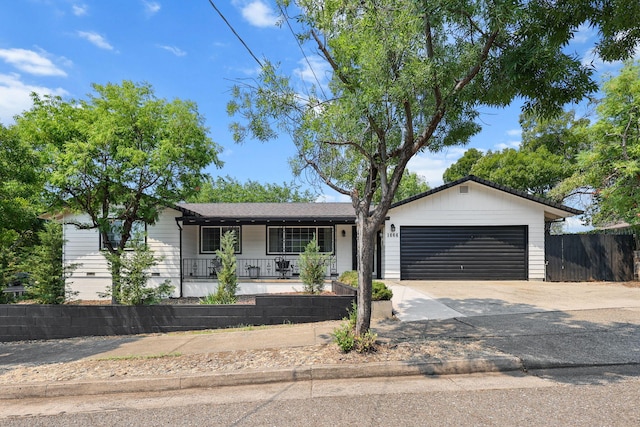 1666 Willis St, Redding, CA 96001 - single story home with covered porch, concrete driveway, and a garage