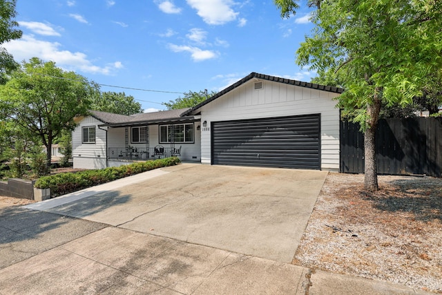 1666 Willis St, Redding, CA 96001 - ranch-style home with driveway, a garage, and covered porch