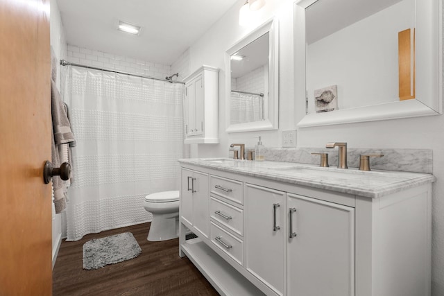 1666 Willis St, Redding, CA 96001 - bathroom featuring double vanity, wood finished floors, and a shower with shower curtain