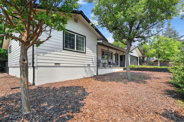 1666 Willis St, Redding, CA 96001 - back of house featuring crawl space and covered porch