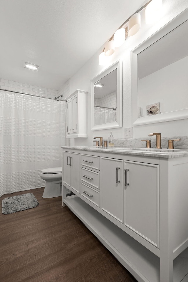 1666 Willis St, Redding, CA 96001 - full bathroom featuring vanity, wood finished floors, and a shower with shower curtain