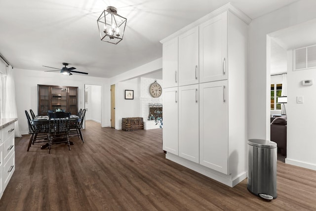 1666 Willis St, Redding, CA 96001 - dining area featuring dark wood-type flooring, ceiling fan, and a chandelier