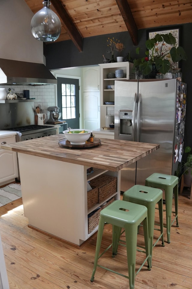 261 Salt Flat Rd, Lewiston, CA 96052 - kitchen with butcher block countertops, stainless steel refrigerator with ice dispenser, open shelves, exhaust hood, and a wooden ceiling with exposed beams