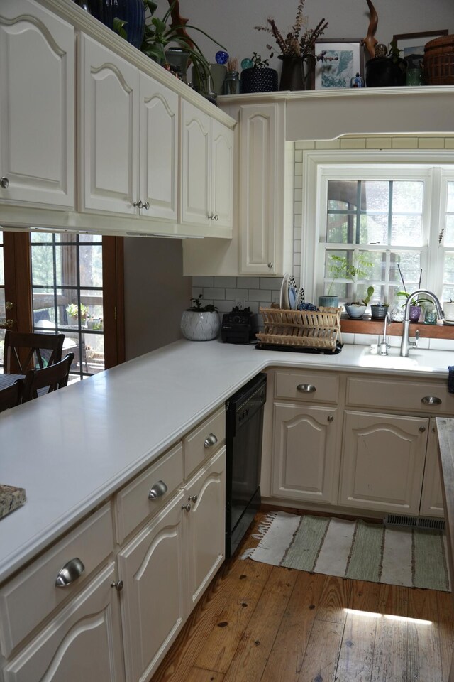 261 Salt Flat Rd, Lewiston, CA 96052 - kitchen featuring black dishwasher, plenty of natural light, backsplash, and light wood-style flooring