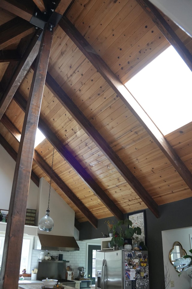261 Salt Flat Rd, Lewiston, CA 96052 - kitchen view of stainless steel refrigerator with ice dispenser, a wood ceiling with exposed beams, pendant lighting, and exhaust hood