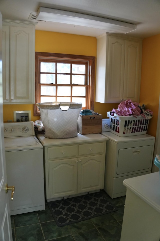 261 Salt Flat Rd, Lewiston, CA 96052 - laundry area with cabinet space, dark tile patterned flooring, and washing machine and clothes dryer
