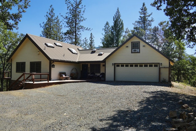 261 Salt Flat Rd, Lewiston, CA 96052 - view of front of home featuring a deck, a metal roof, driveway, and an attached garage