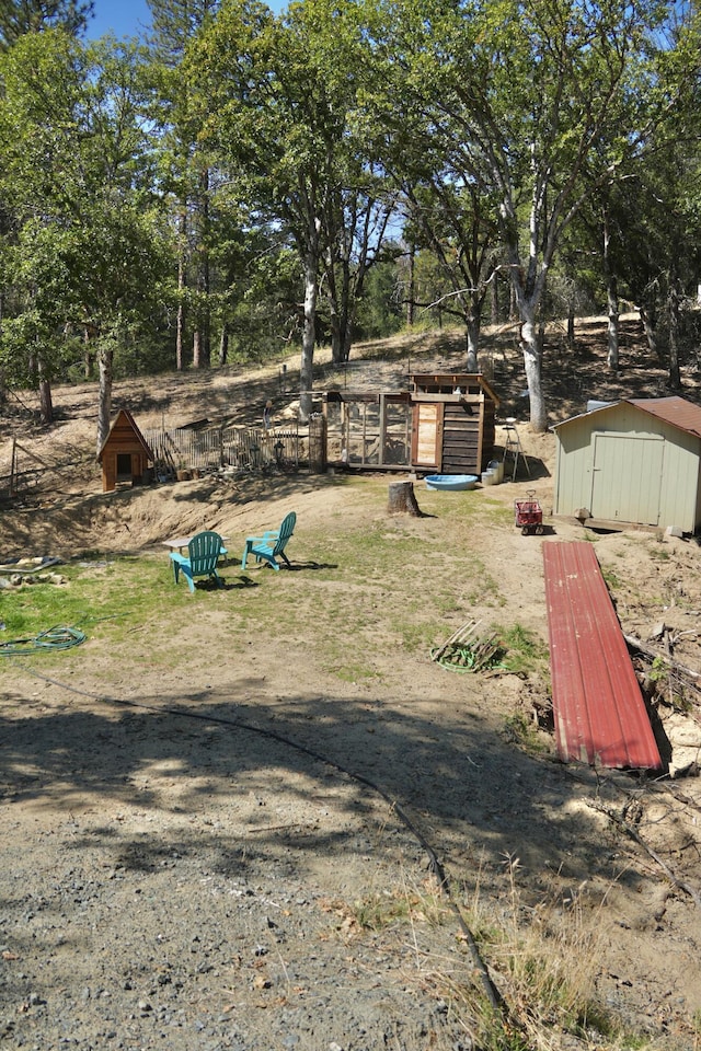 261 Salt Flat Rd, Lewiston, CA 96052 - surrounding community featuring a storage unit and view of wooded area