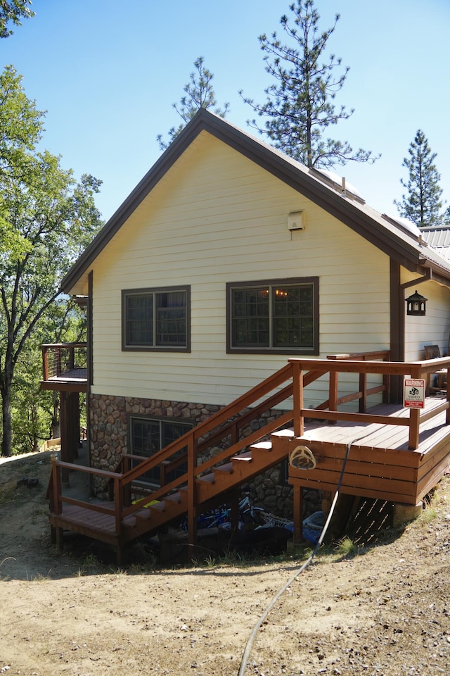 261 Salt Flat Rd, Lewiston, CA 96052 - rear view of property featuring stone siding and a deck