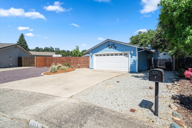 466 Tourmaline Way, Redding, CA 96003 - ranch-style home featuring concrete driveway, an attached garage, and a gate