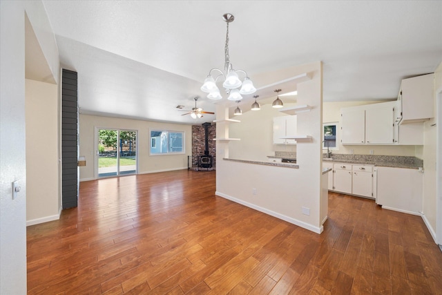 466 Tourmaline Way, Redding, CA 96003 - kitchen with a chandelier, ceiling fan, white cabinets, dark wood-type flooring, and open floor plan