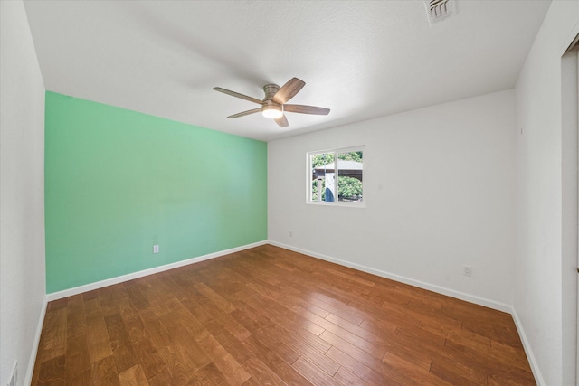 466 Tourmaline Way, Redding, CA 96003 - empty room with a ceiling fan and wood finished floors