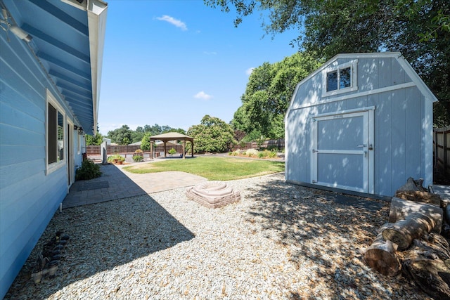 466 Tourmaline Way, Redding, CA 96003 - fenced backyard with a gazebo, a storage unit, and a patio