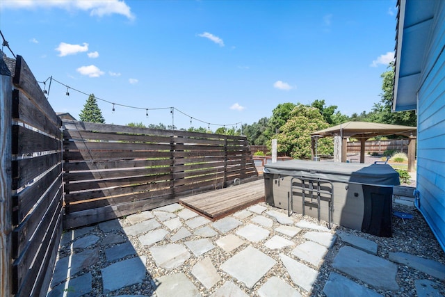 466 Tourmaline Way, Redding, CA 96003 - fenced backyard featuring a hot tub, a patio, and a wooden deck