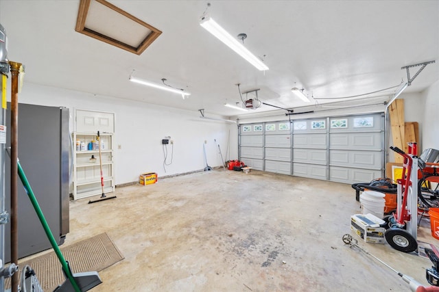 466 Tourmaline Way, Redding, CA 96003 - garage with freestanding refrigerator and a garage door opener
