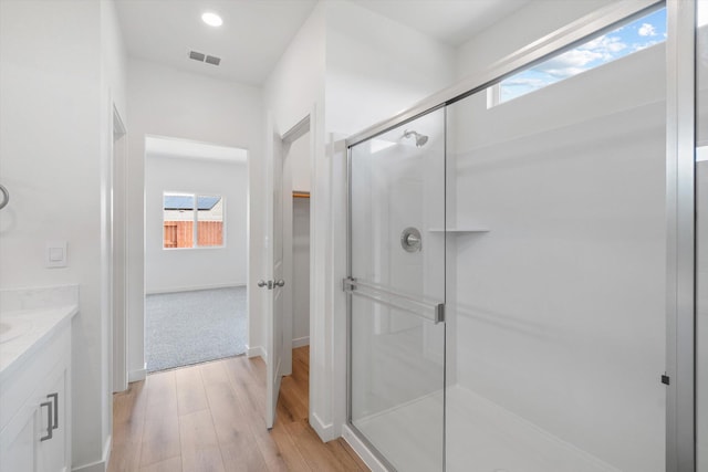 4206 Acadia Pl, Redding, CA 96001 - bathroom featuring wood finished floors, a shower stall, plenty of natural light, vanity, and recessed lighting