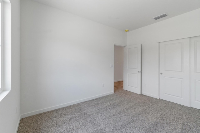 4206 Acadia Pl, Redding, CA 96001 - unfurnished bedroom with carpet flooring, baseboards, and a closet
