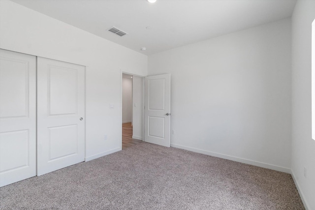 4206 Acadia Pl, Redding, CA 96001 - unfurnished bedroom with light carpet, a closet, and baseboards