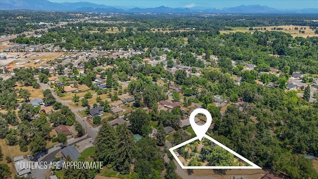 2551 S Waverly Ave, Redding, CA 96001 - aerial overview of property's location with mountains and property parcel outlined