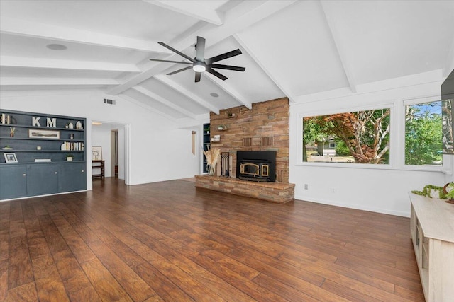 2551 S Waverly Ave, Redding, CA 96001 - unfurnished living room with dark wood finished floors, plenty of natural light, a ceiling fan, and a wood stove