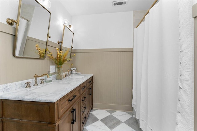 2551 S Waverly Ave, Redding, CA 96001 - bathroom featuring double vanity, baseboards, tile patterned floors, and curtained shower