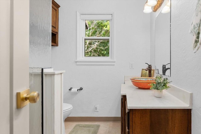 2551 S Waverly Ave, Redding, CA 96001 - bathroom with vanity, toilet, and baseboards