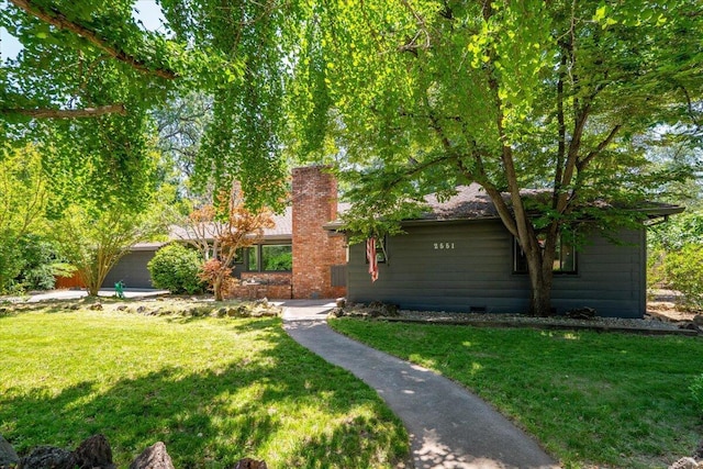 2551 S Waverly Ave, Redding, CA 96001 - view of front of property featuring a front lawn and a chimney