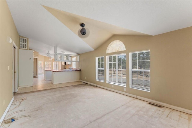 22400 E Elk Trl, Redding, CA 96003 - unfurnished living room with a ceiling fan, lofted ceiling, and baseboards