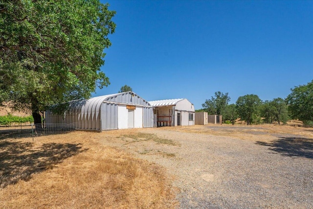22400 E Elk Trl, Redding, CA 96003 - view of yard featuring a detached garage and an outbuilding