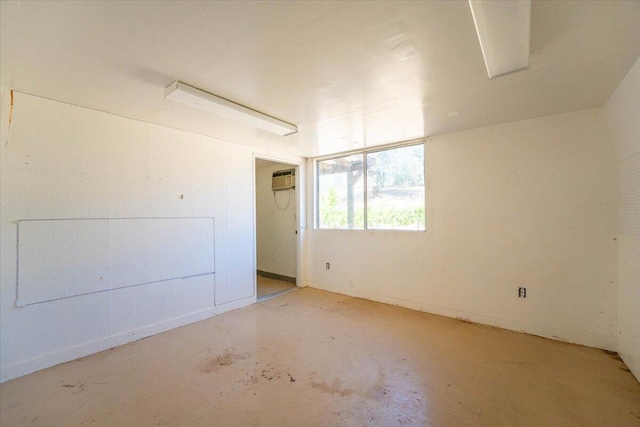 22400 E Elk Trl, Redding, CA 96003 - spare room featuring concrete flooring and an AC wall unit