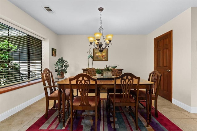 2364 La Madre Ct, Redding, CA 96002 - dining area featuring a chandelier, light tile patterned flooring, and baseboards