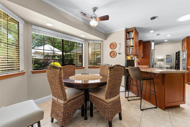 2364 La Madre Ct, Redding, CA 96002 - dining room with crown molding, a ceiling fan, plenty of natural light, light tile patterned flooring, and recessed lighting