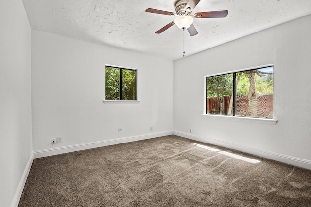 20650 Matamoros St, Redding, CA 96002 - carpeted empty room with healthy amount of natural light, baseboards, ceiling fan, and a textured ceiling