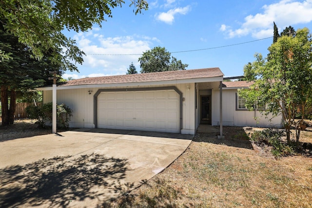 20650 Matamoros St, Redding, CA 96002 - ranch-style home featuring an attached garage and driveway