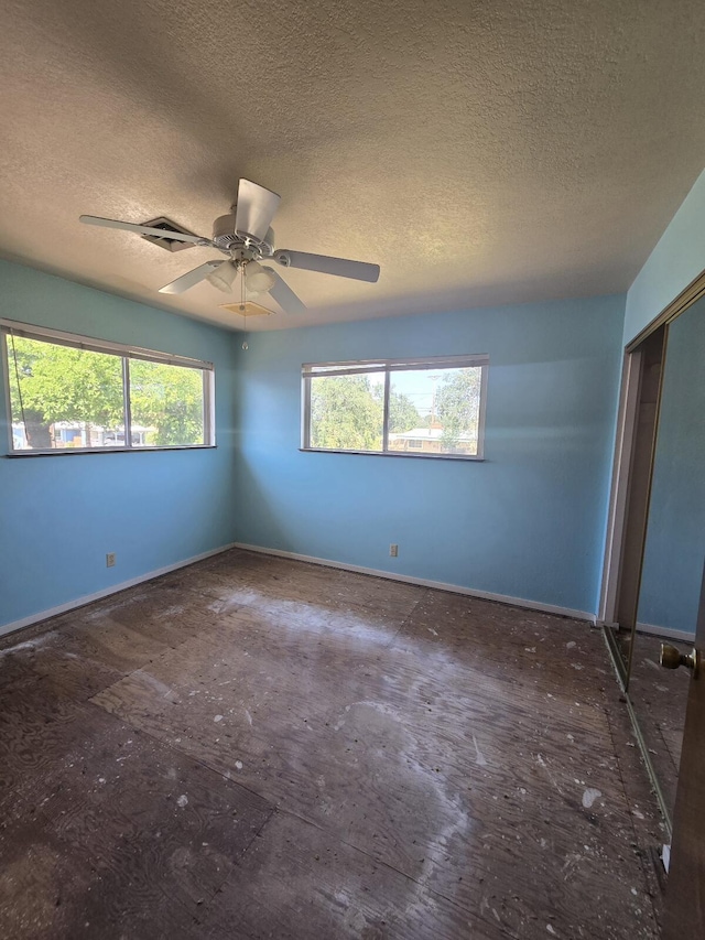 846 Ridge Rd, Redding, CA 96003 - unfurnished room with a textured ceiling, a ceiling fan, and baseboards