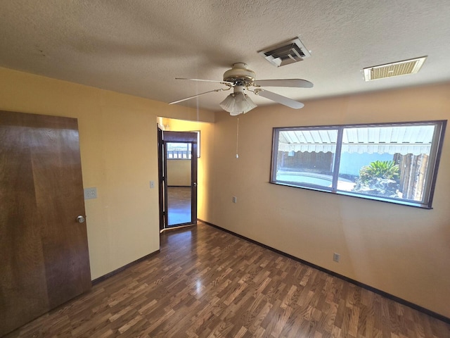 846 Ridge Rd, Redding, CA 96003 - empty room with ceiling fan, wood finished floors, a textured ceiling, and baseboards