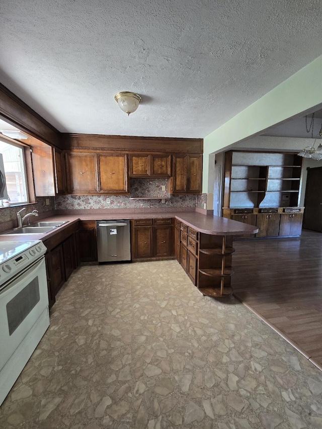 846 Ridge Rd, Redding, CA 96003 - kitchen featuring dishwasher, white range with electric stovetop, a sink, backsplash, and a peninsula