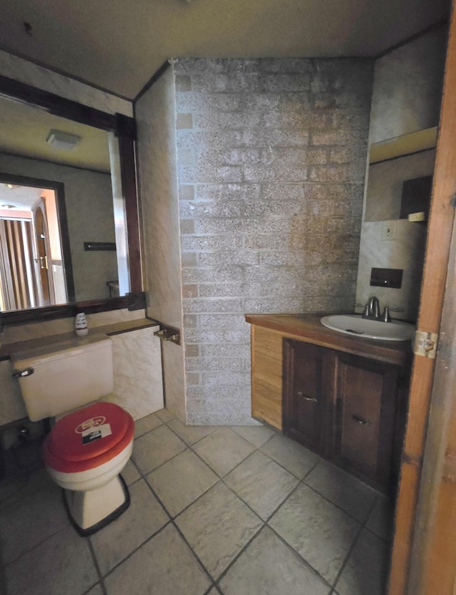 846 Ridge Rd, Redding, CA 96003 - half bath featuring tile patterned flooring, vanity, tile walls, and toilet