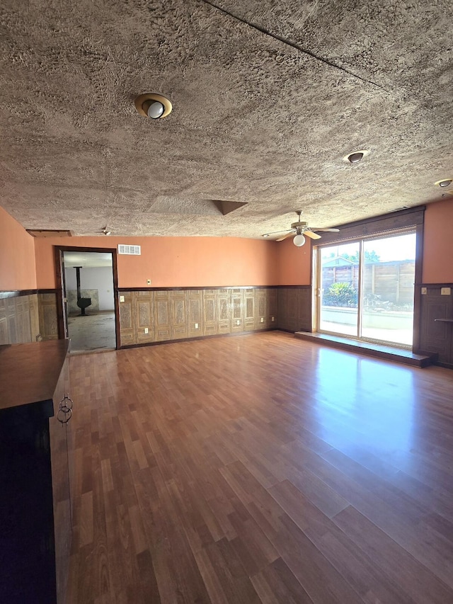 846 Ridge Rd, Redding, CA 96003 - unfurnished living room featuring a ceiling fan, wainscoting, and wood finished floors