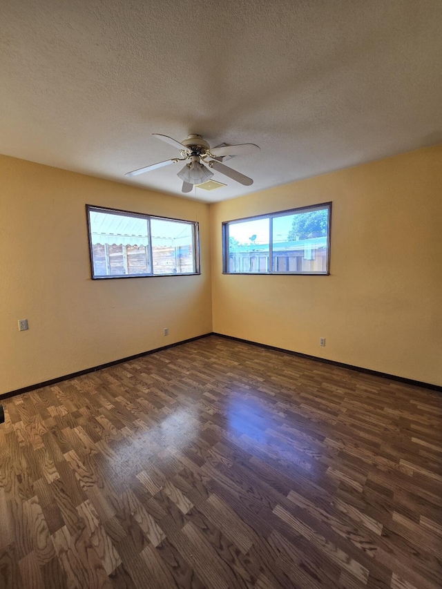 846 Ridge Rd, Redding, CA 96003 - empty room with ceiling fan, dark wood-type flooring, baseboards, and a textured ceiling