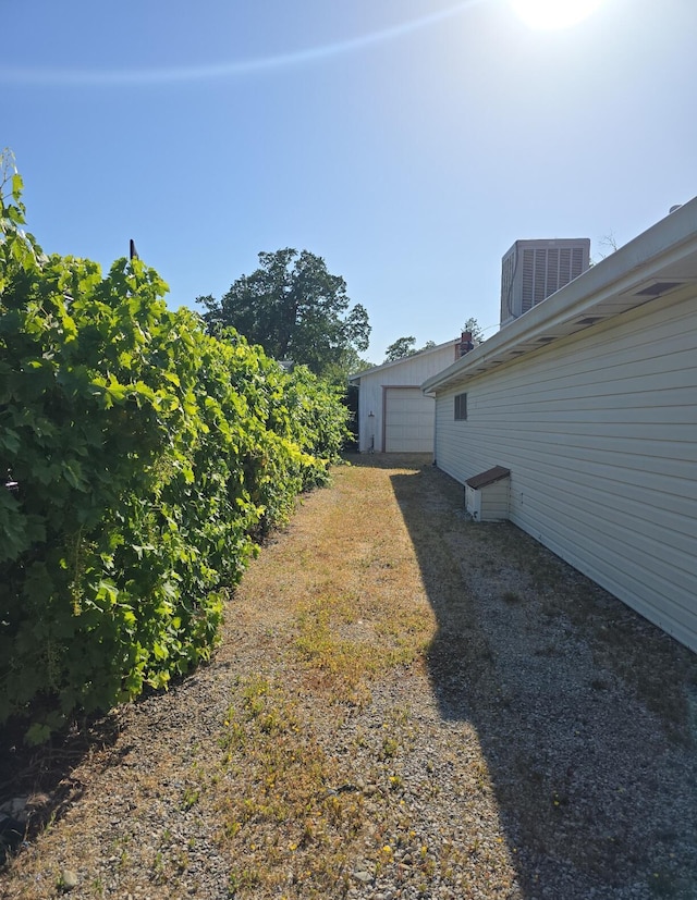846 Ridge Rd, Redding, CA 96003 - view of yard with central AC and a garage