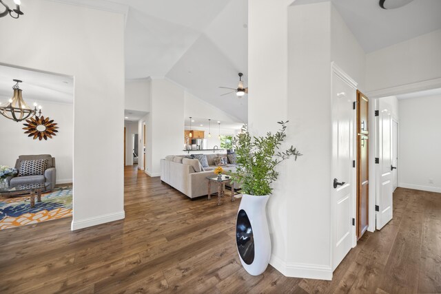 4648 Kilkee Dr, Redding, CA 96001 - hall with a chandelier, wood finished floors, baseboards, and high vaulted ceiling