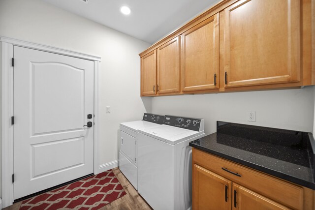 4648 Kilkee Dr, Redding, CA 96001 - washroom featuring cabinet space, washer and dryer, recessed lighting, wood finished floors, and baseboards